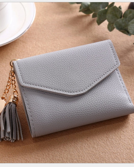 Women's short Korean version of the bag Tassel pendant lychee wallet multi-card position Clutch bag